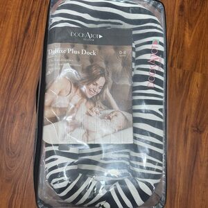 DockATot Deluxe+ 2 covers- “So Safari” & white. With Case & extra pad cover!